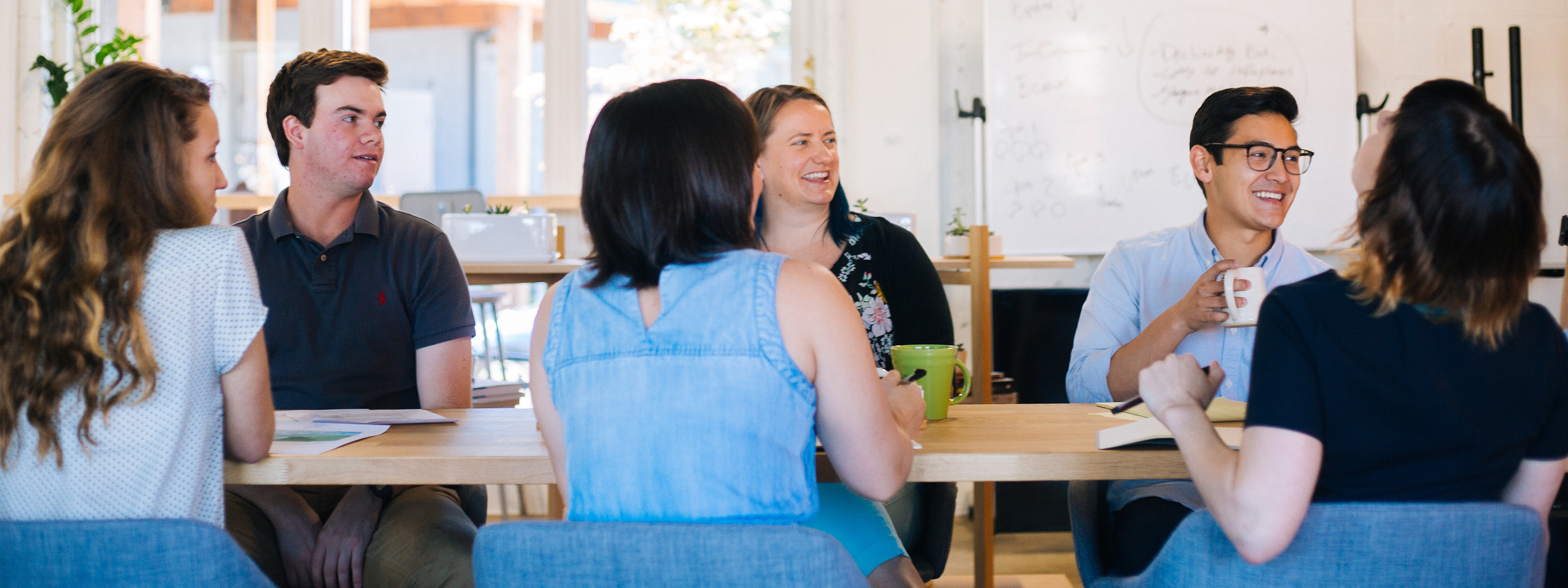 Staff talking at conference table