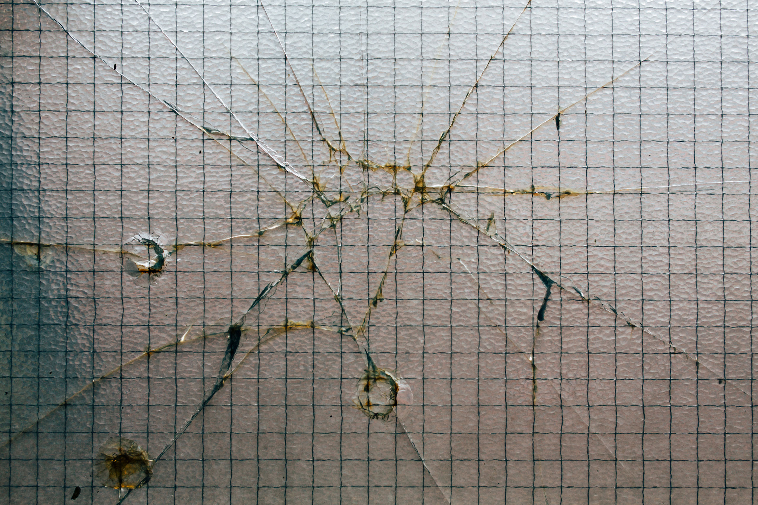 Window with bullet holes