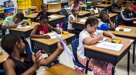 Students coloring at their desks